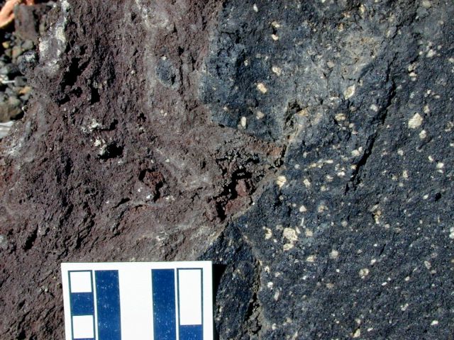Close up view of basaltic mantle on dacite airfall fragments